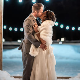 wedding couple in front of ice rink